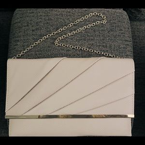 Nude Clutch with gold trim and gold chain strap